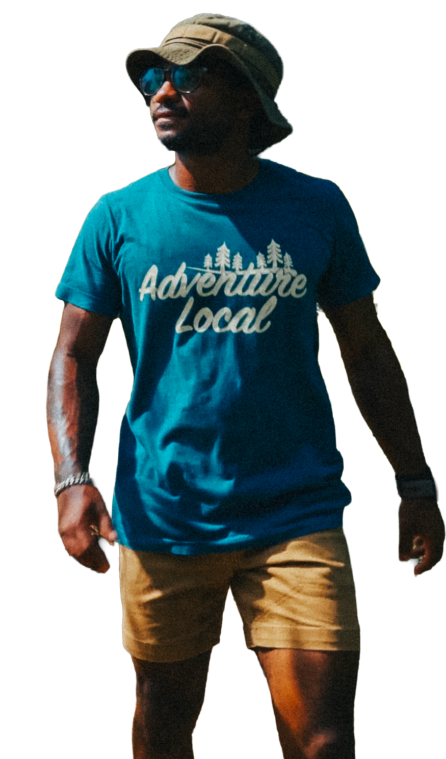 A man wearing sunglasses, a bucket hat, a blue t-shirt with trees and the words "Adventure Local," and tan shorts.