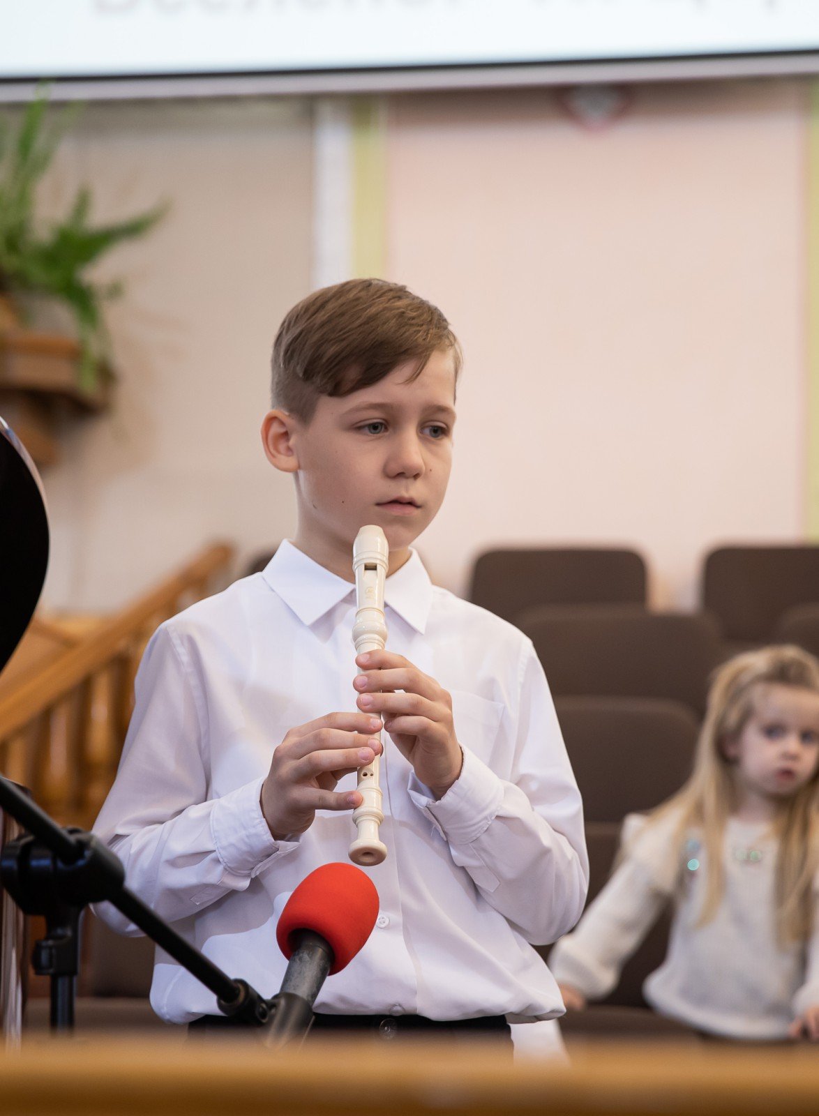 Mykola playing the recorder at their Easter church service