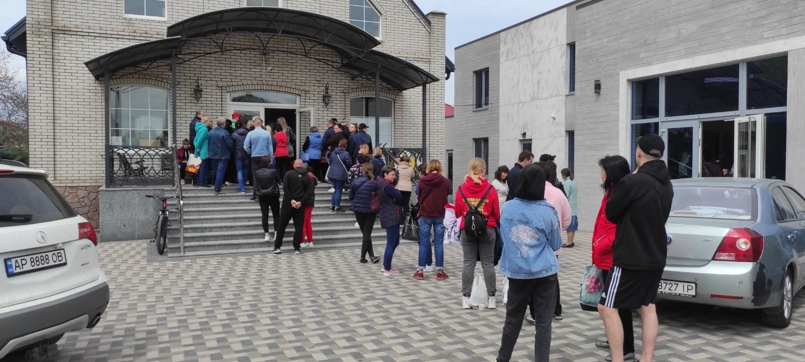 People waiting in line for humanitarian assistance