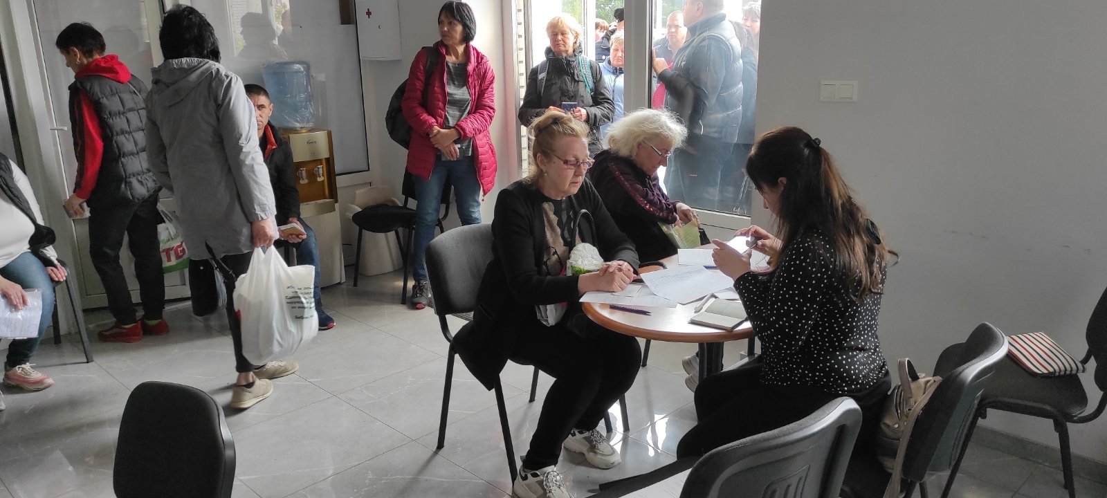 Volunteers completing intake forms to determine a family’s needs for assistance