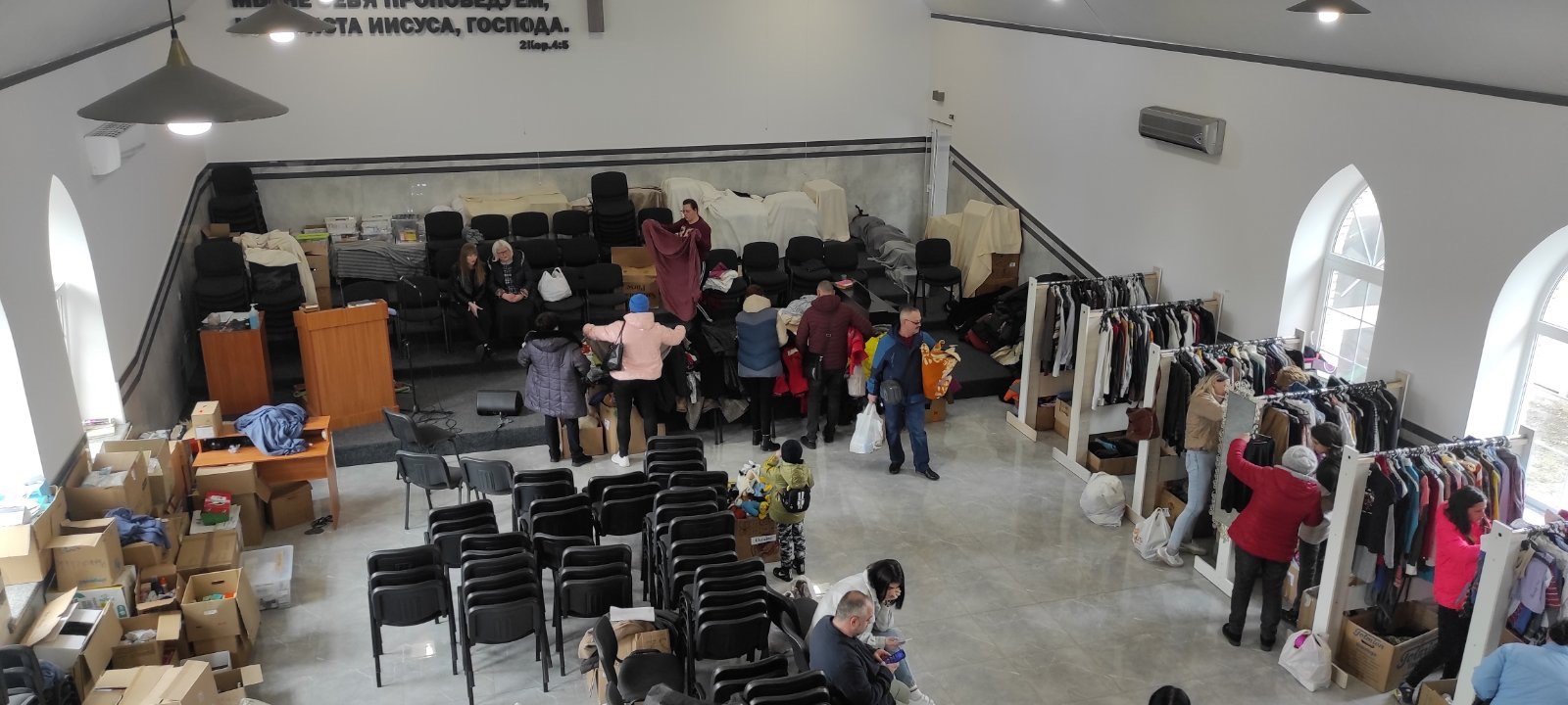 People picking out clothing and household items they need, available to them at no cost