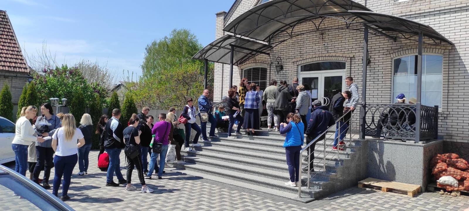 People waiting in line for humanitarian assistance