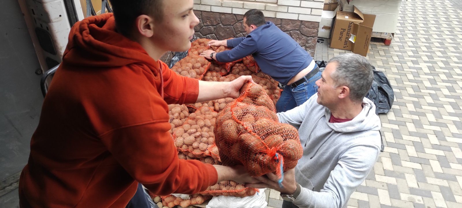 Unloading potatoes delivered from other parts of Ukraine to Zaporizhzhia