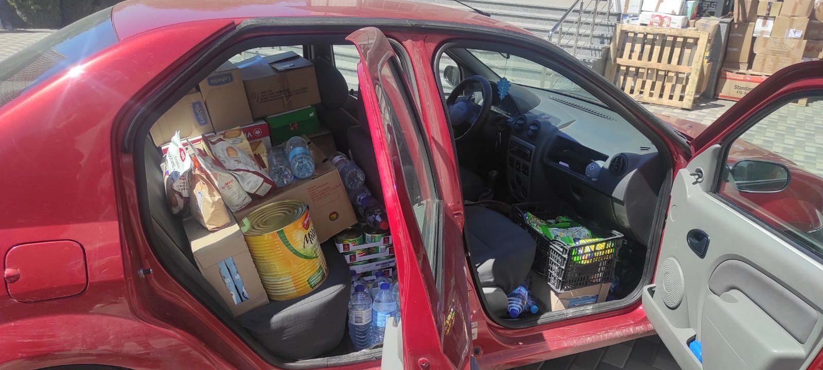 A car loaded with food and humanitarian supplies