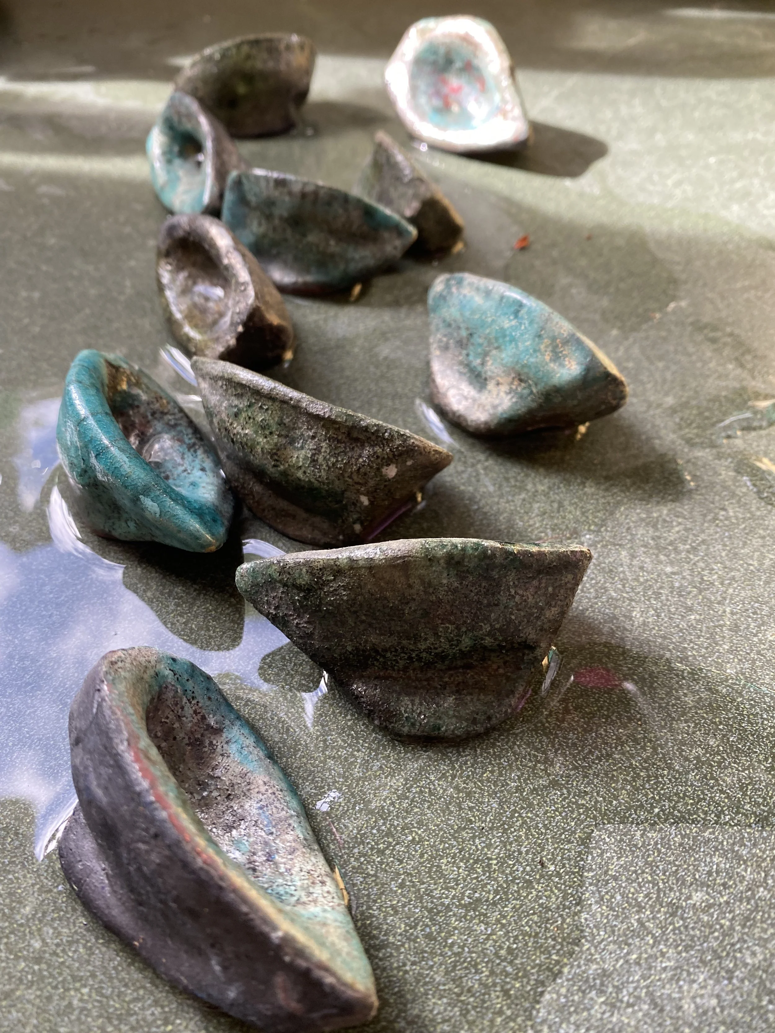 Hulls: raku clay assorted glazes (1995) 