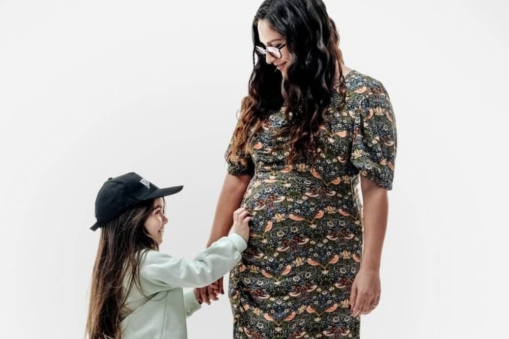 Pregnant mother and her daughter