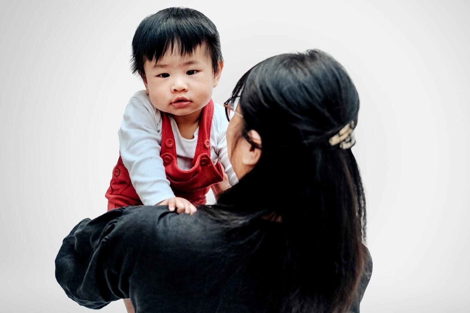 Woman holding her son