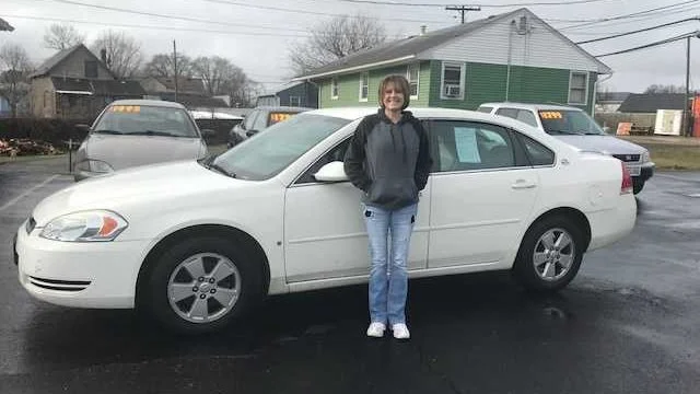PICCA Wheels to Work - woman in front of white car
