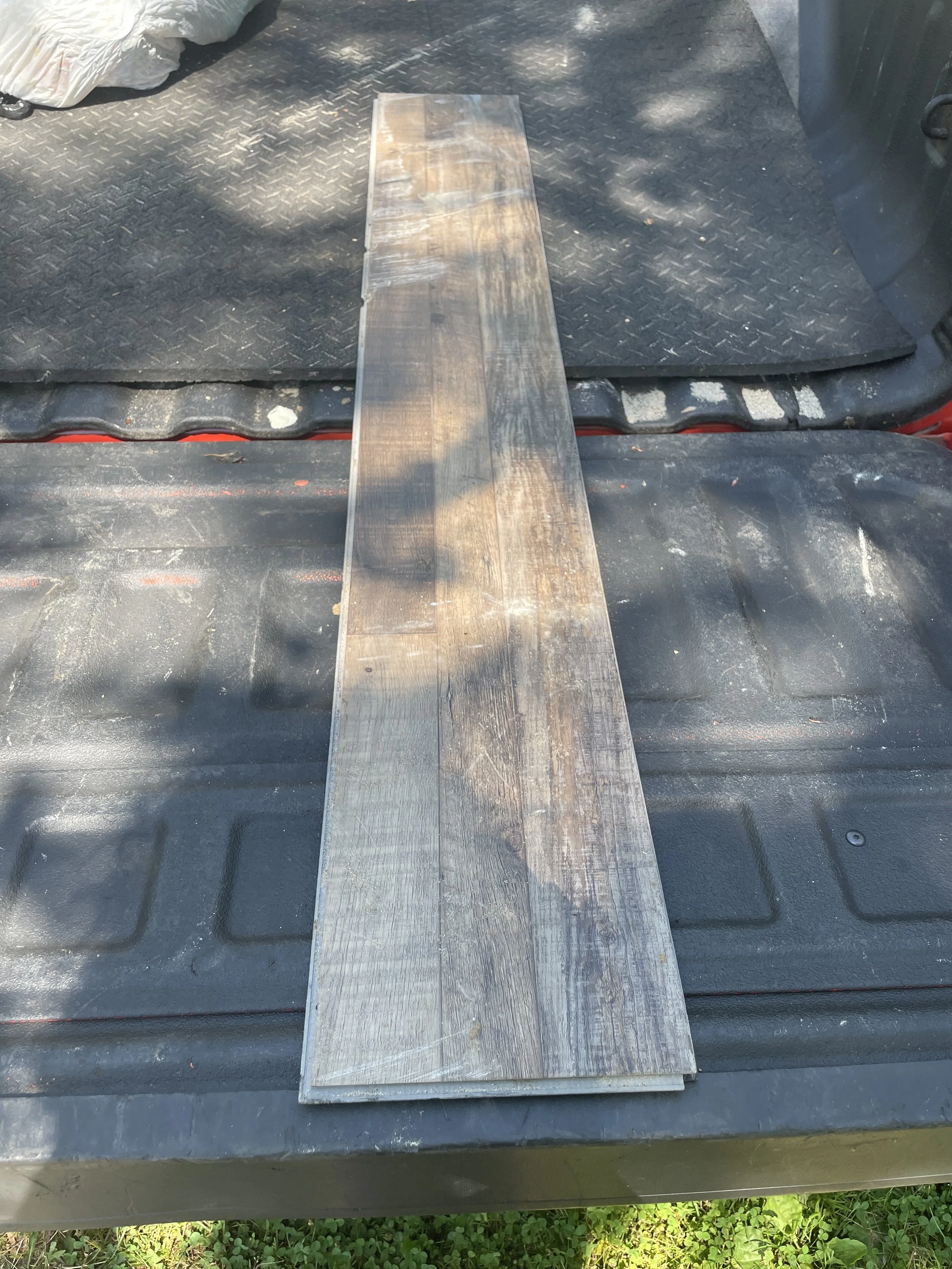 6-28-2025 collected piece of flooring.JPG
