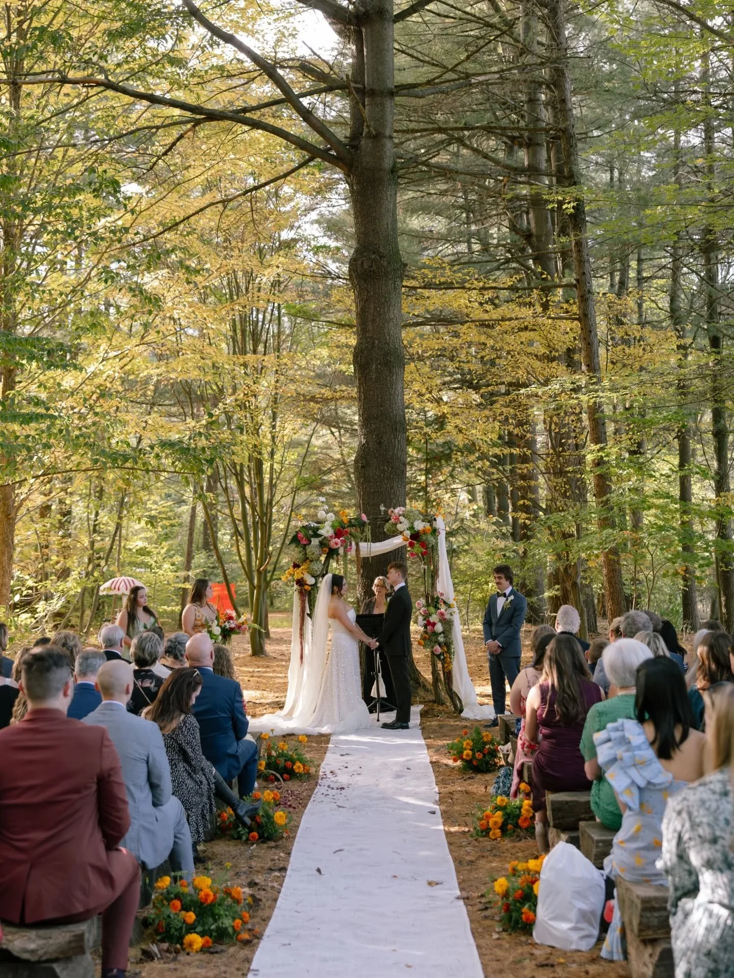 Some wedding days just sing. 
It's hard to know what exactly sets them apart but it's probably a little bit of everything. Marissa and Sam's day was simply bursting with autumn sunshine, bright pops of color, and so much joy and playful energy. I'll 