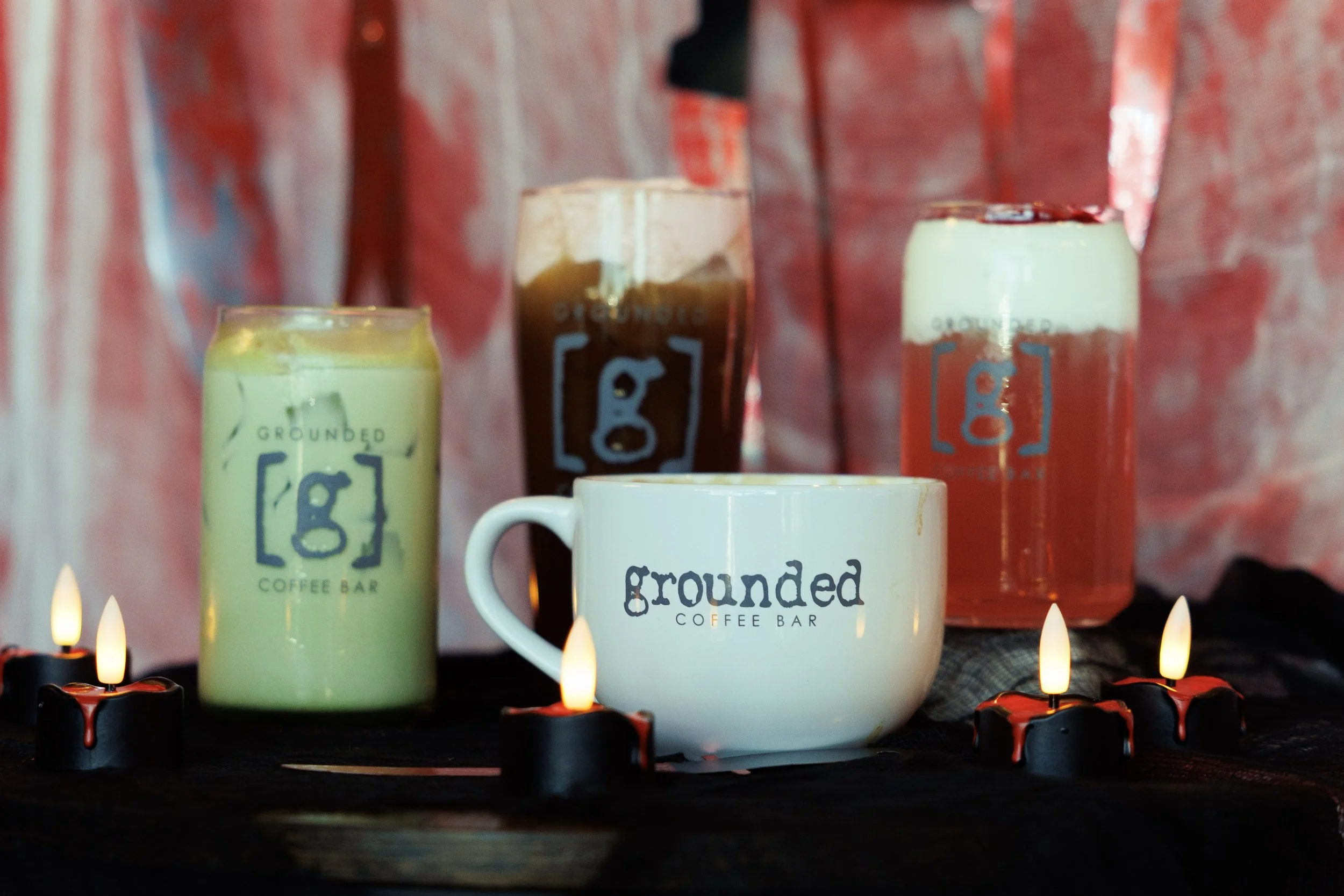 four beverages on a Halloween slasher movie themed table