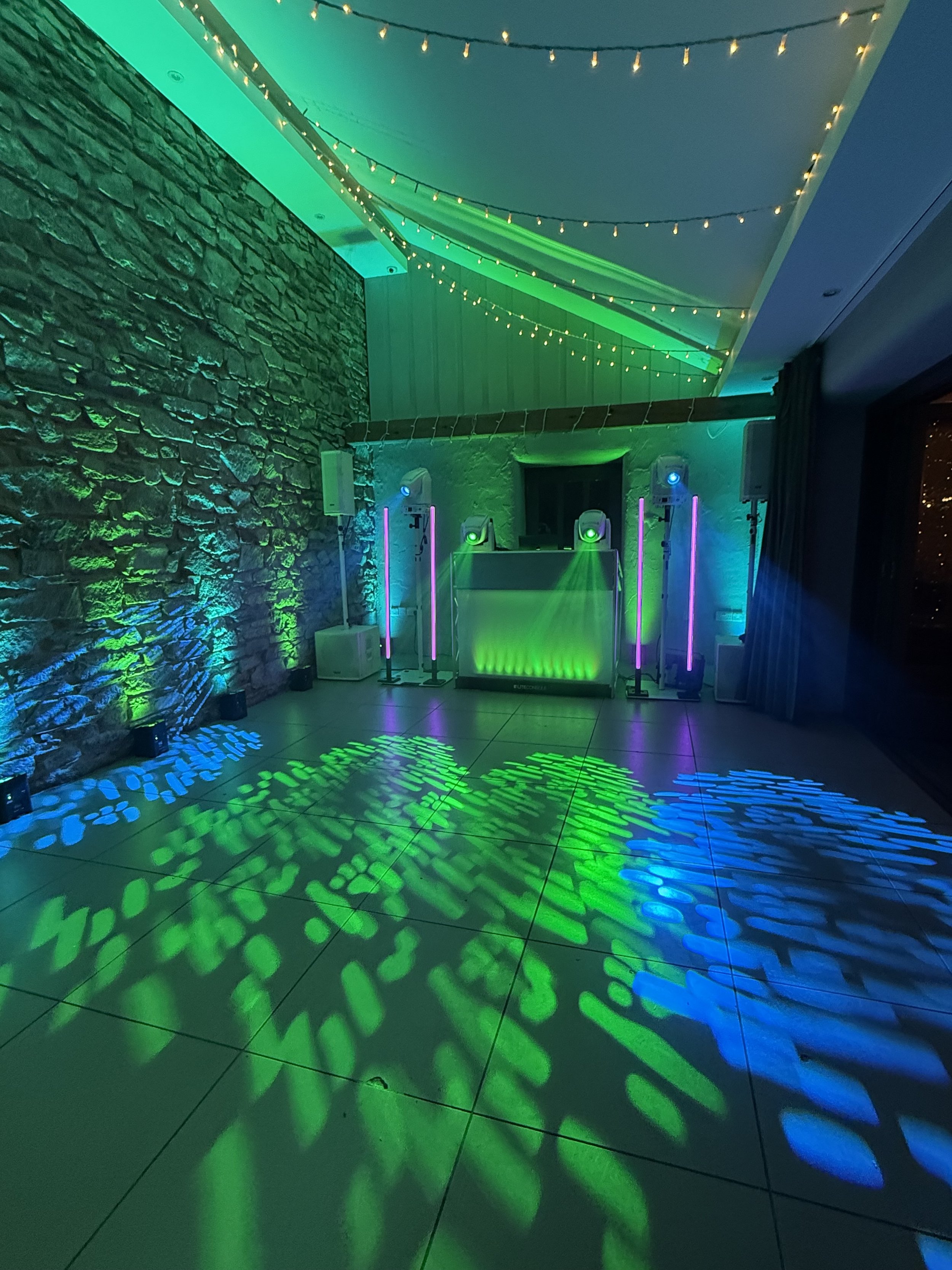TREVENNA BARNS  ST NEOT DJ setup with lighting and venue uplighting.