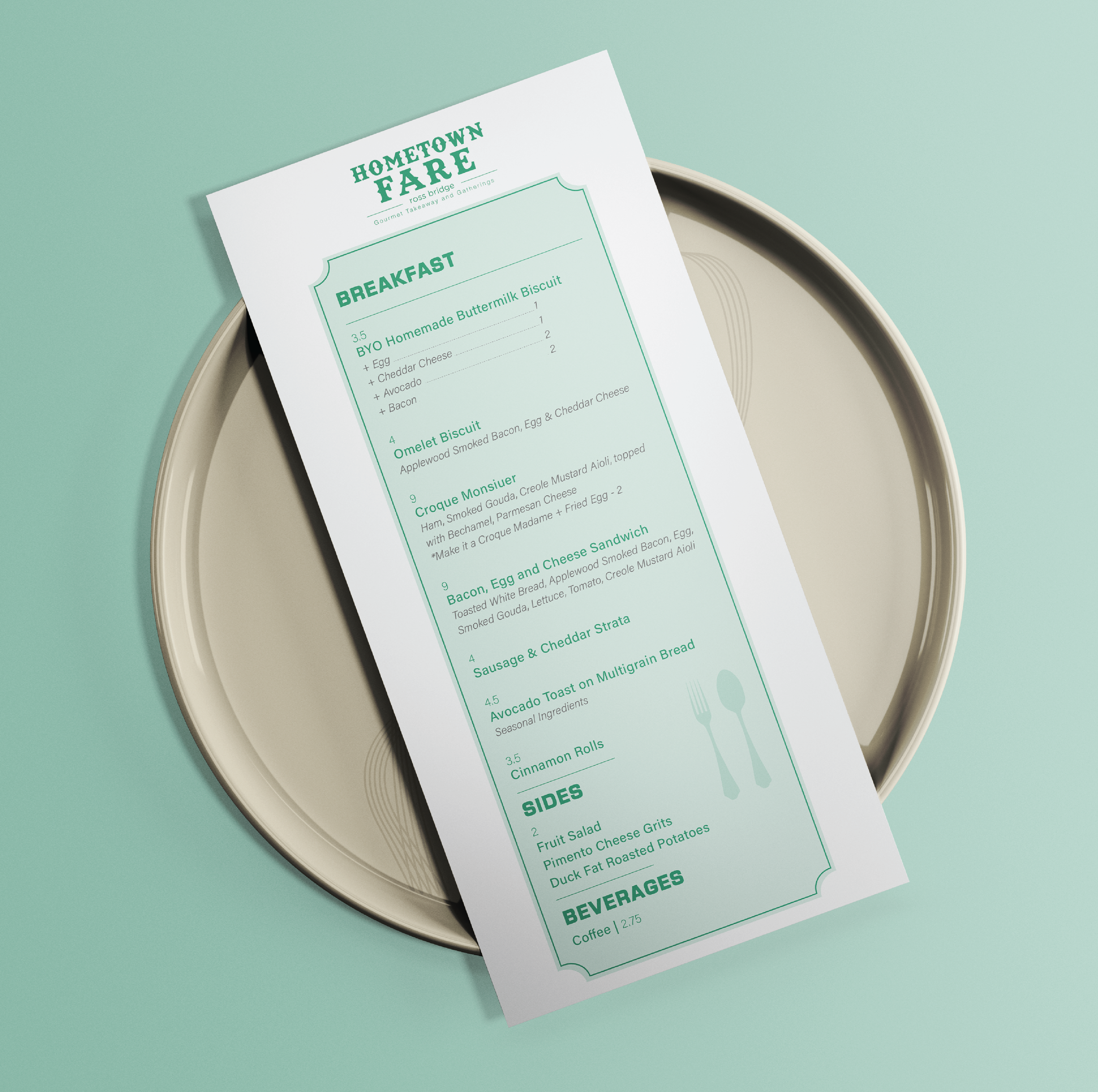 A breakfast menu titled "Hometown Fare" with items such as homemade buttermilk biscuit, omelet biscuit, croque monsieur, bacon, egg and cheese sandwich, sausage and cheddar strata, avocado toast, cinnamon rolls, sides, and beverages, placed on a beig