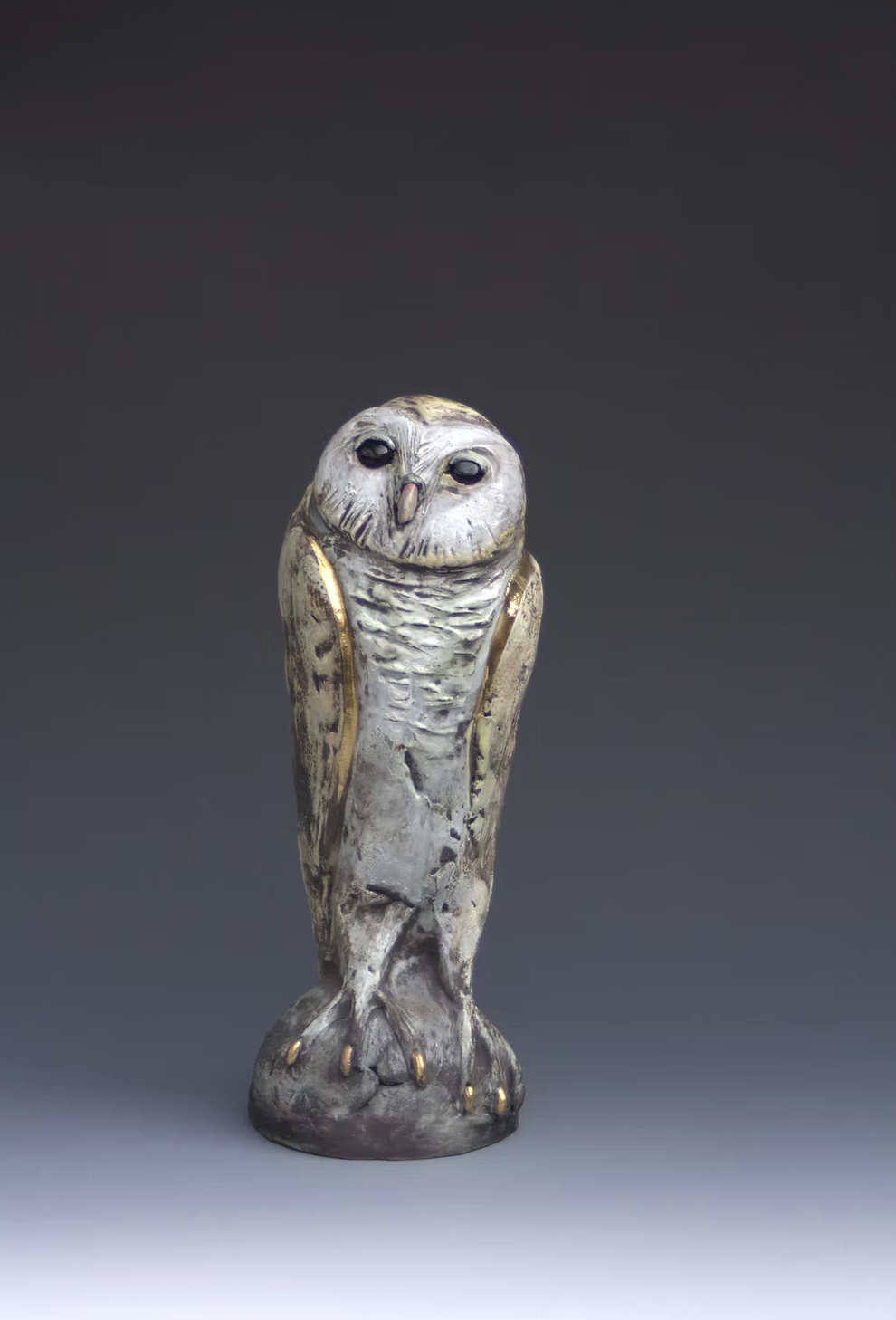 An original handbuilt ceramic sculpture by British ceramicist Jack Durling of a Golden-touched Barn Owl.