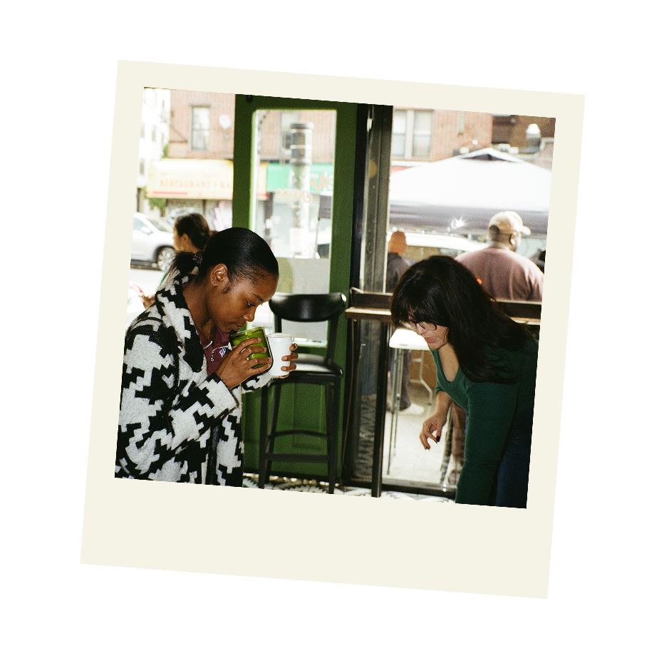Polaroid style photo of women in store purchasing a candle