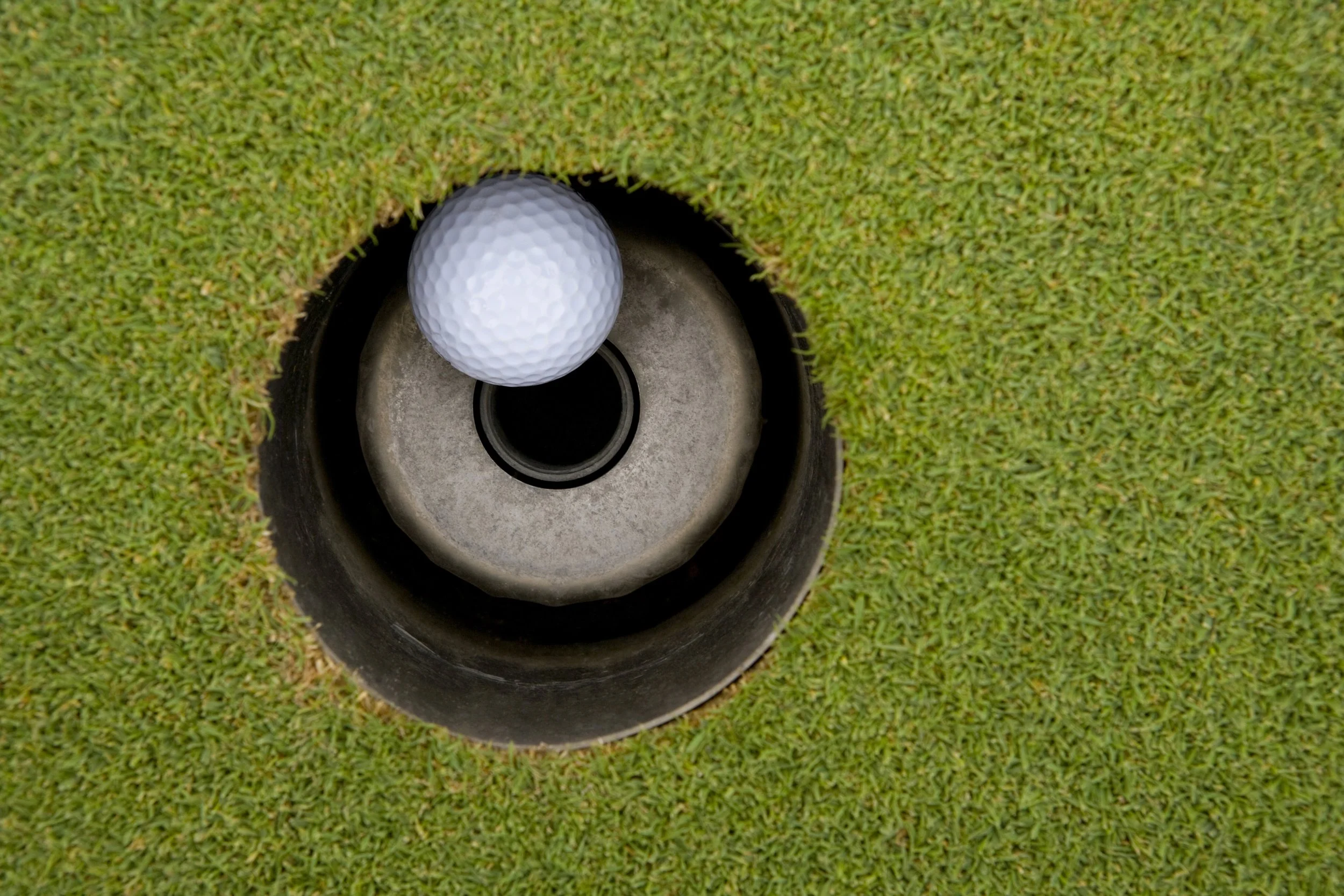 close-up-of-golf-ball-in-hole-2026-03-09-21-50-17-utc.jpg