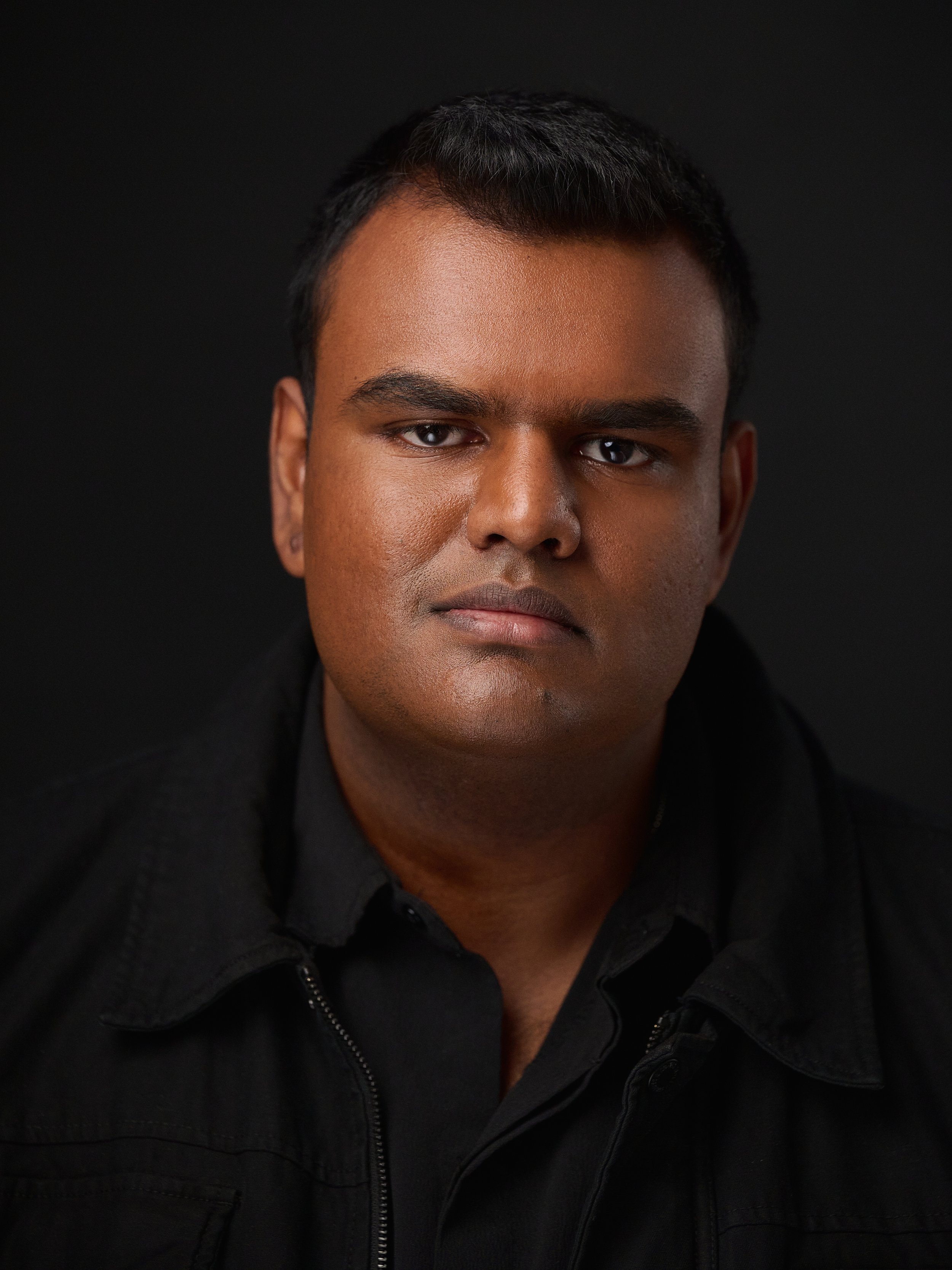 A Sri Lankan man with black hair and clean shaven profile picture