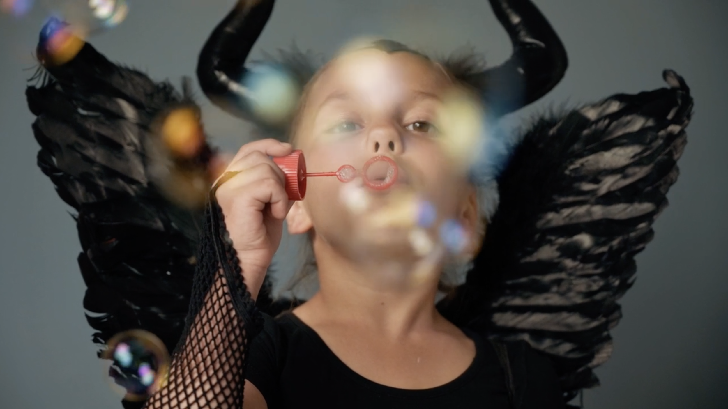 BLOWING BUBBLE DEVIL GIRL Mikhail Nilov | Pexels.png