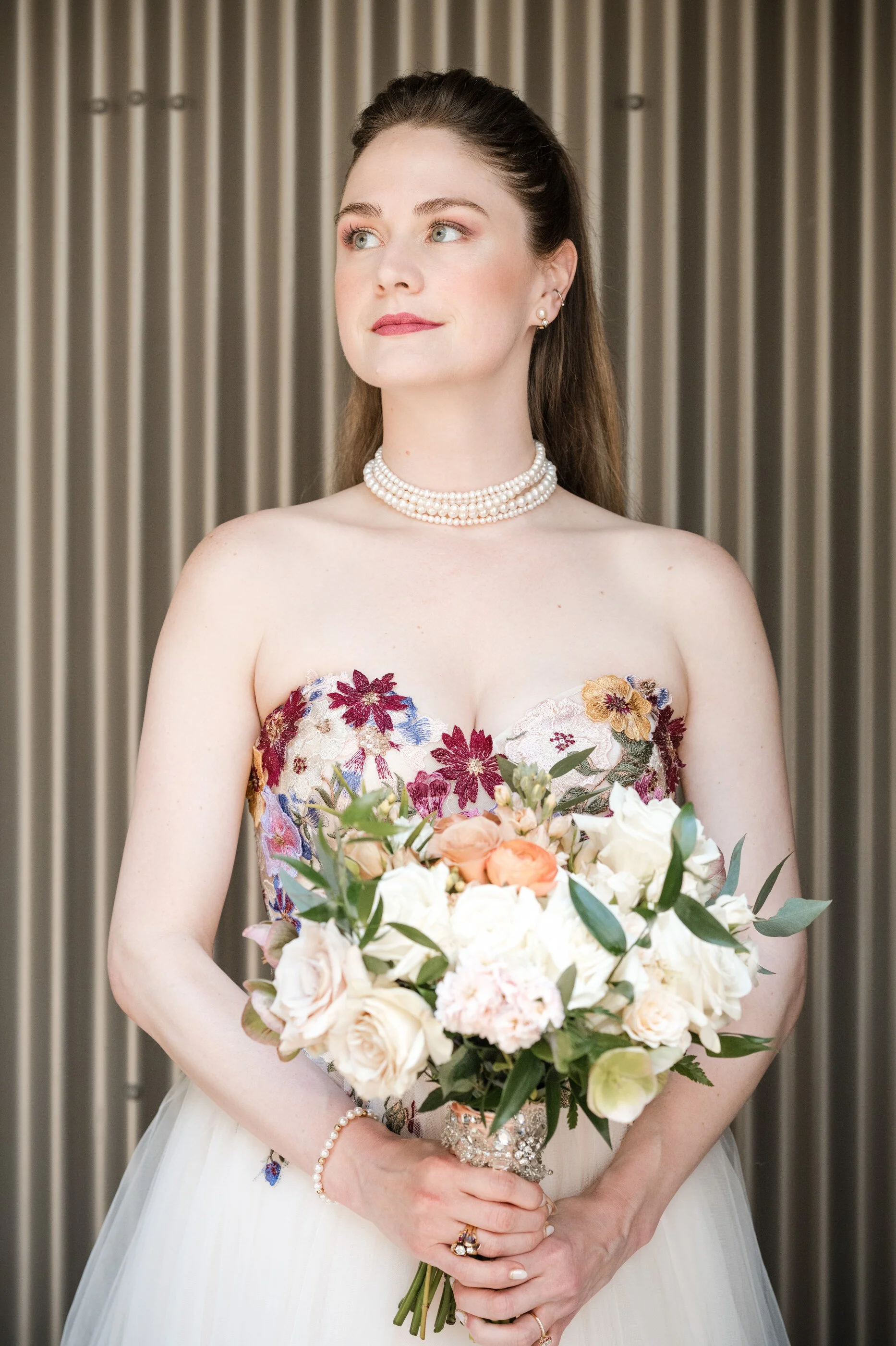 Romantic garden bridal makeup with soft peach eyeshadow, natural, glowing skin, and elegant bridal hairstyle, floral embroidered wedding dress, pearl necklace choker. Warm natural tones for soft autumn bride, color analysis, springtime, bride, natura