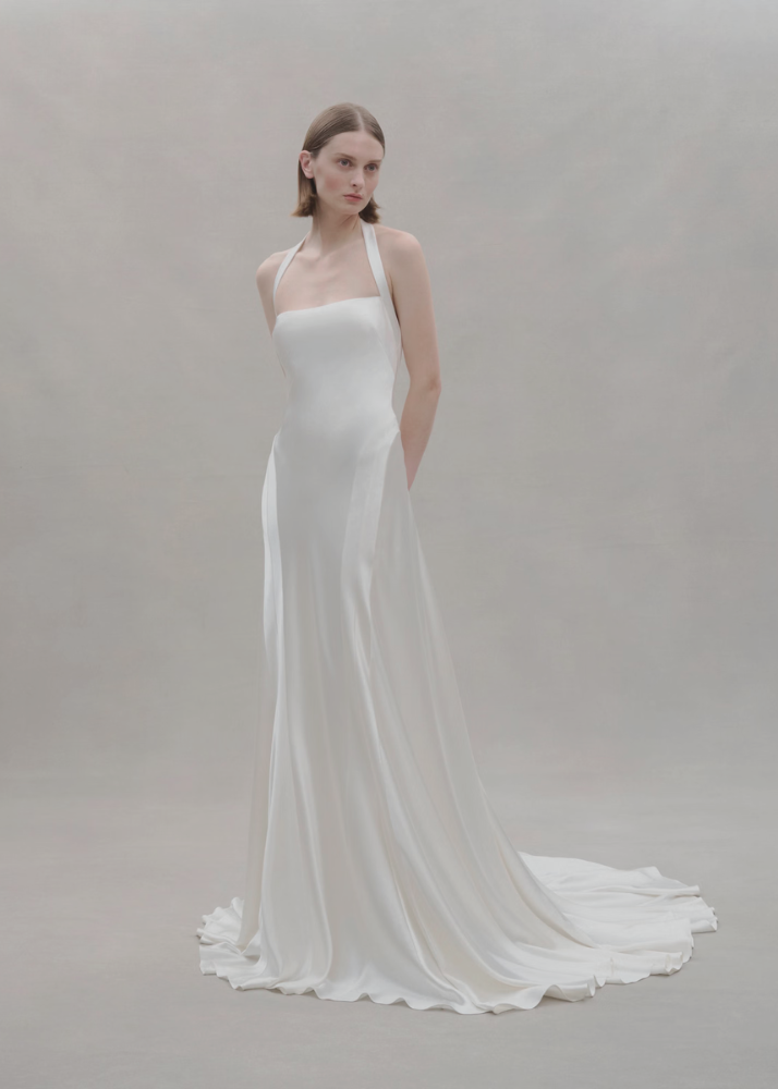Modern luxury Australian bridal gown featuring  a silk crepe halter neck.