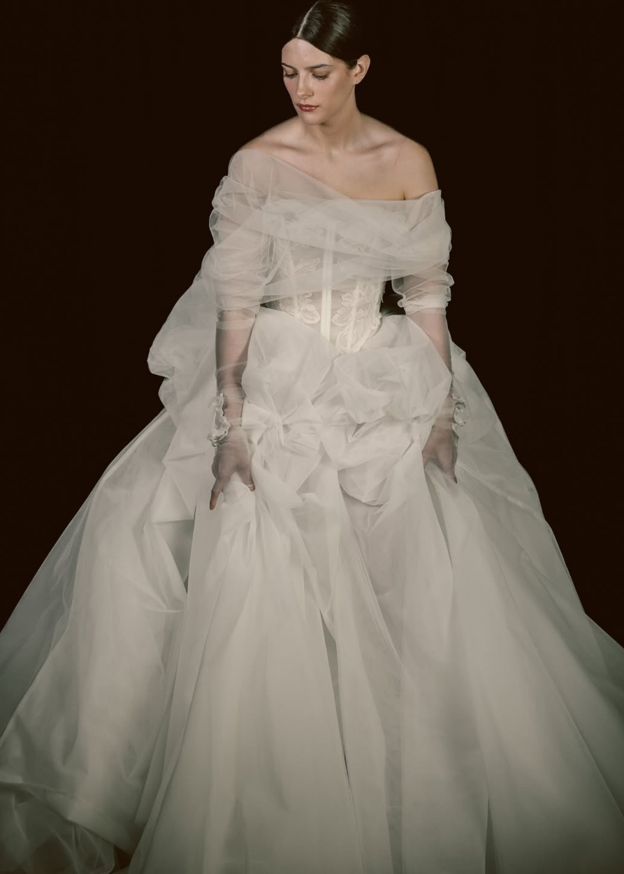 Modern, romantic, different, contemporary bridal skirt pictured on a Bride in ivory on a black background
