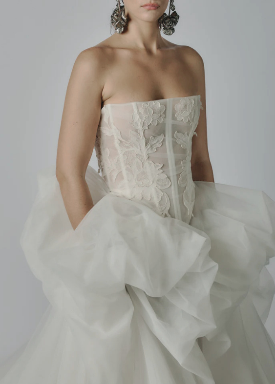 Close up of the intricate lace details of the Varca lyon corset in ivory.  Modern basque waist corset with boning for the contemporary bride.