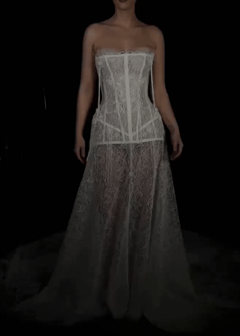 Video of a modern Australian bridal gown on a black background with a delicate lace gown, with contemporary boned corset.