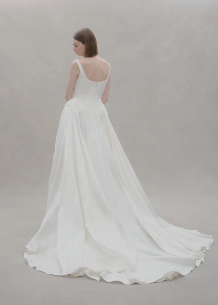 Contemporary Australian designer wedding dress featuring an elongated silk bodice.