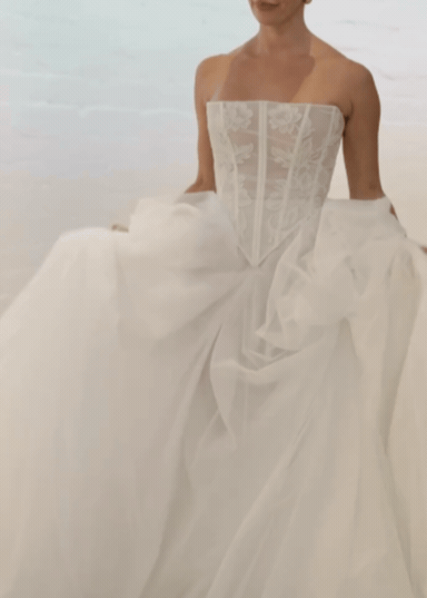 Modern voluminous bridal skirt in ivory, video of Australian fashionable bride with wedding skirt on ivory background in bridal studio.