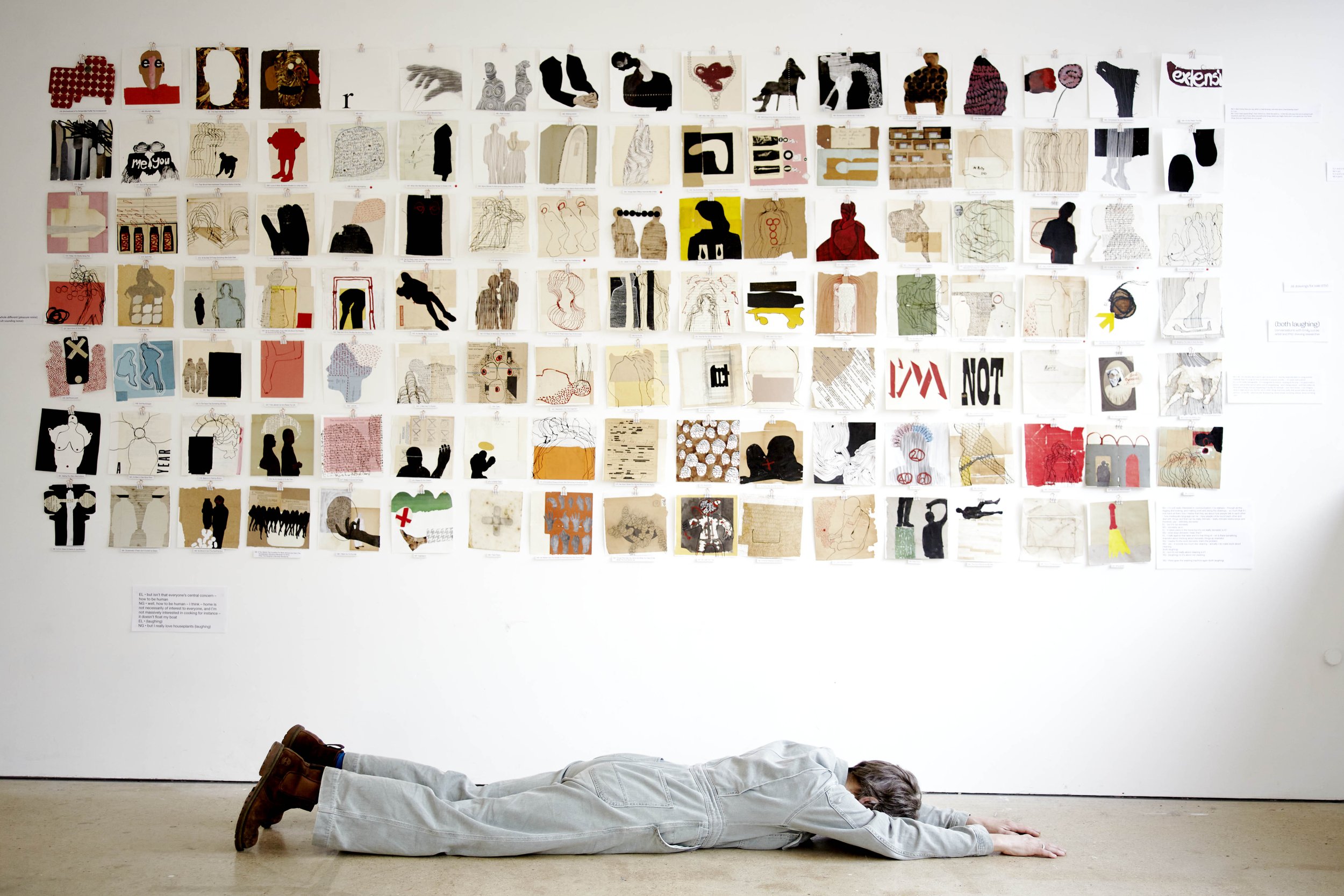 Photograph by Hatty Frances Bell of Nick Grellier lying on the floor in front of her artwork at SVA in Stroud