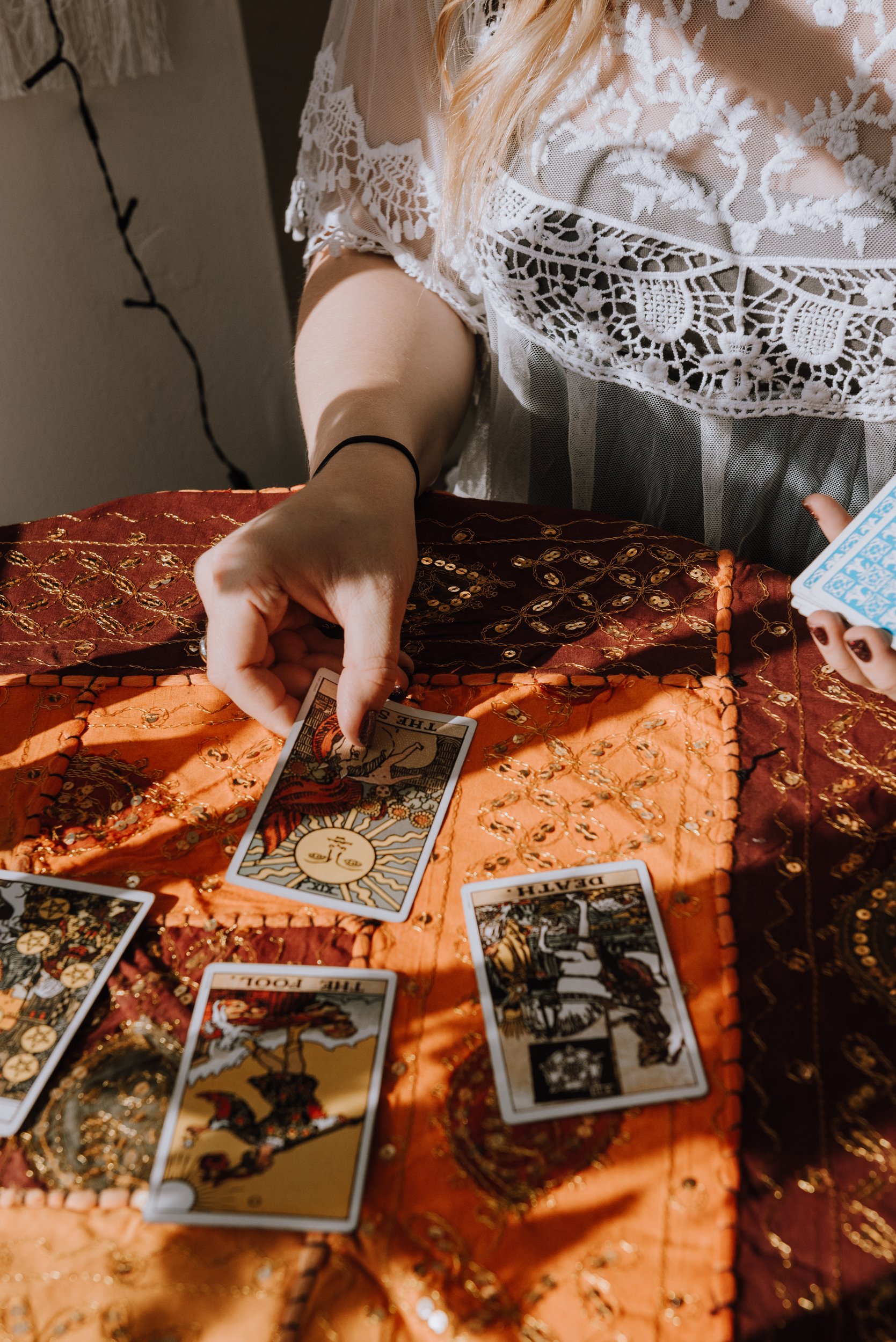 Camilla. Soul Reiki. Close up Tarot cards being placed down