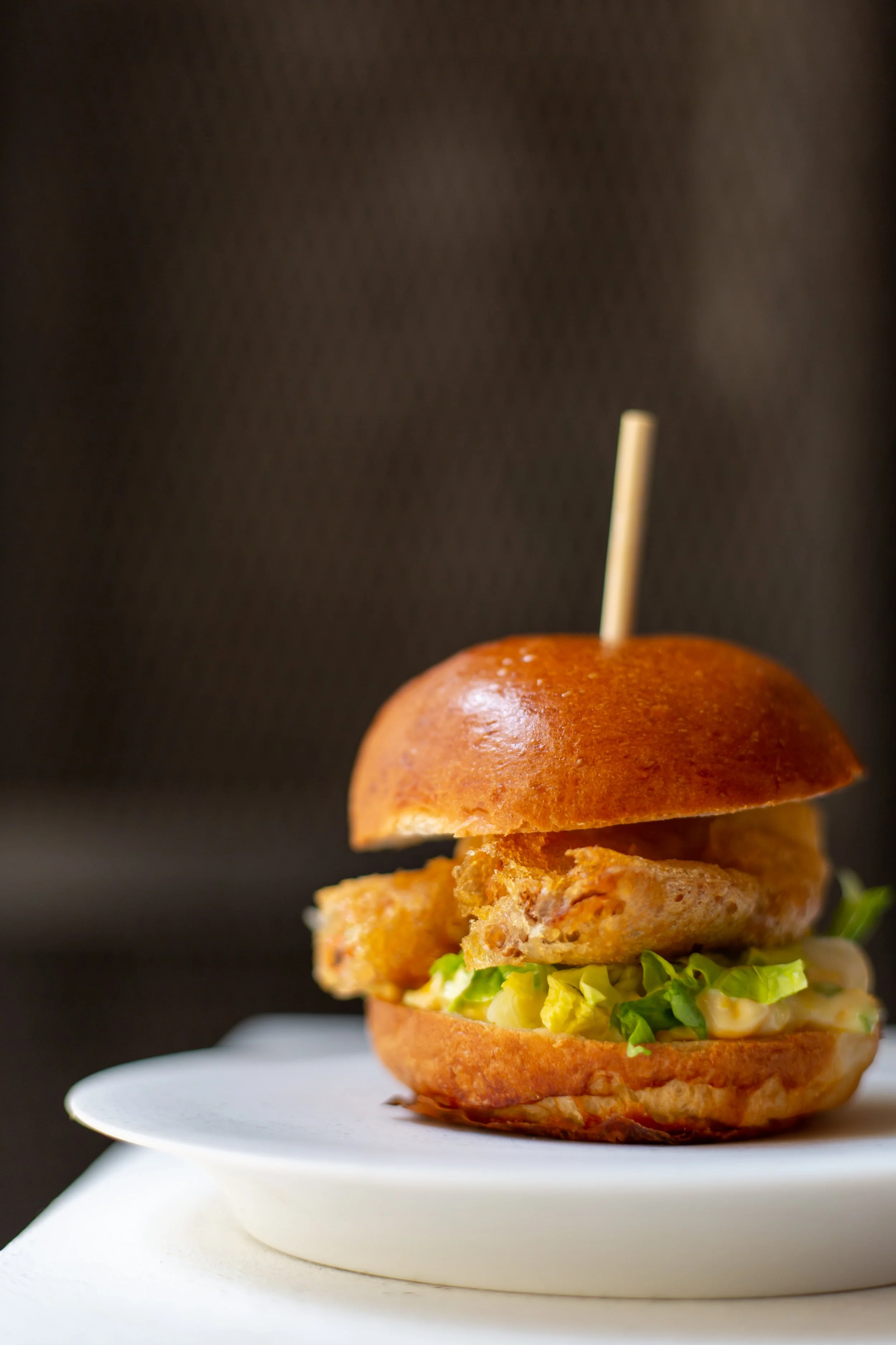 Fish Burger on white plate Tramshed 2 Food photography