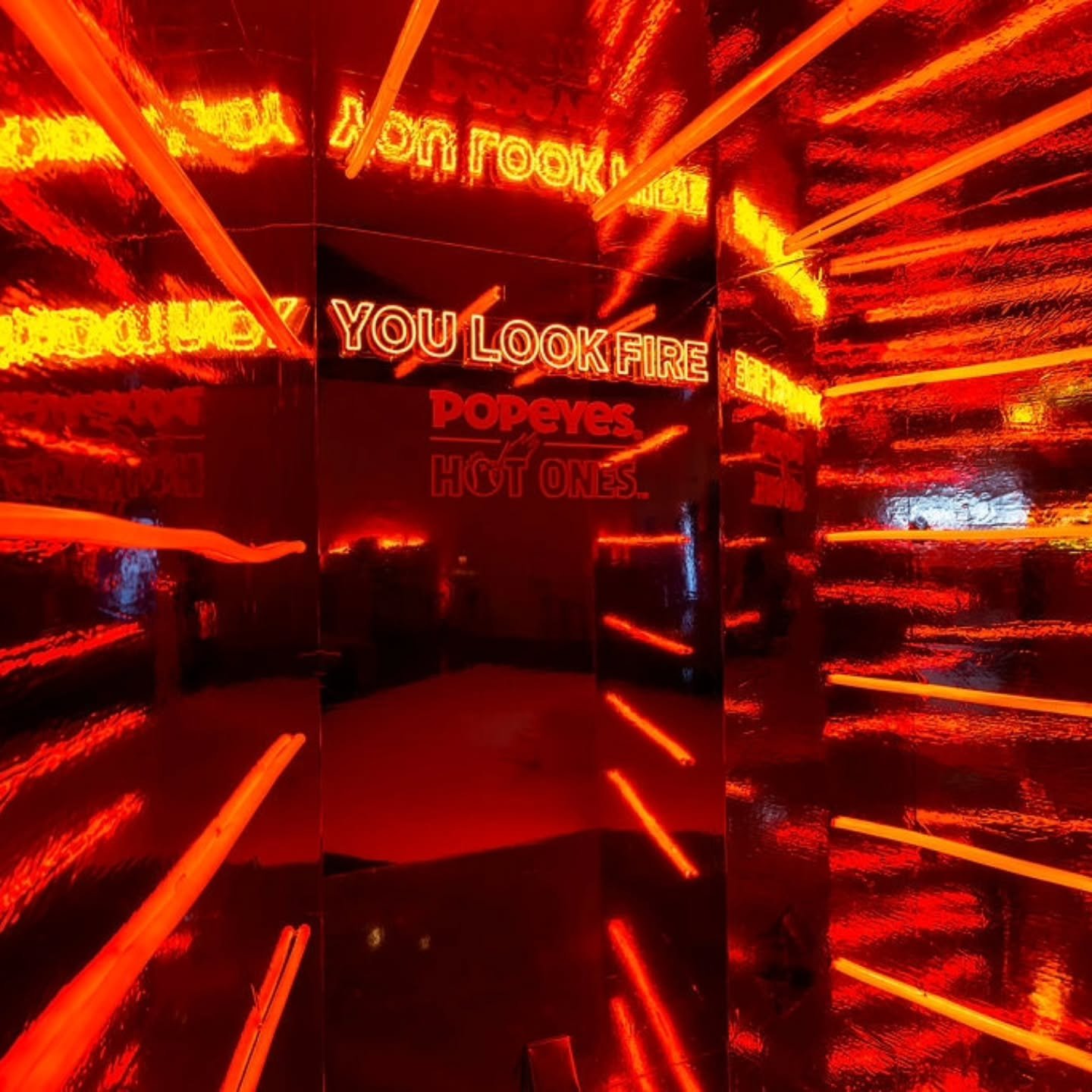 You look fire 🔥 Guests were invited to step inside this blazing-hot photo moment to capture hot content! Featuring mirrored vinyl walls, neon lights, and a haze of fog for that smokin' vibe.

Event Design and Management @madbashgrp
Photography @arth