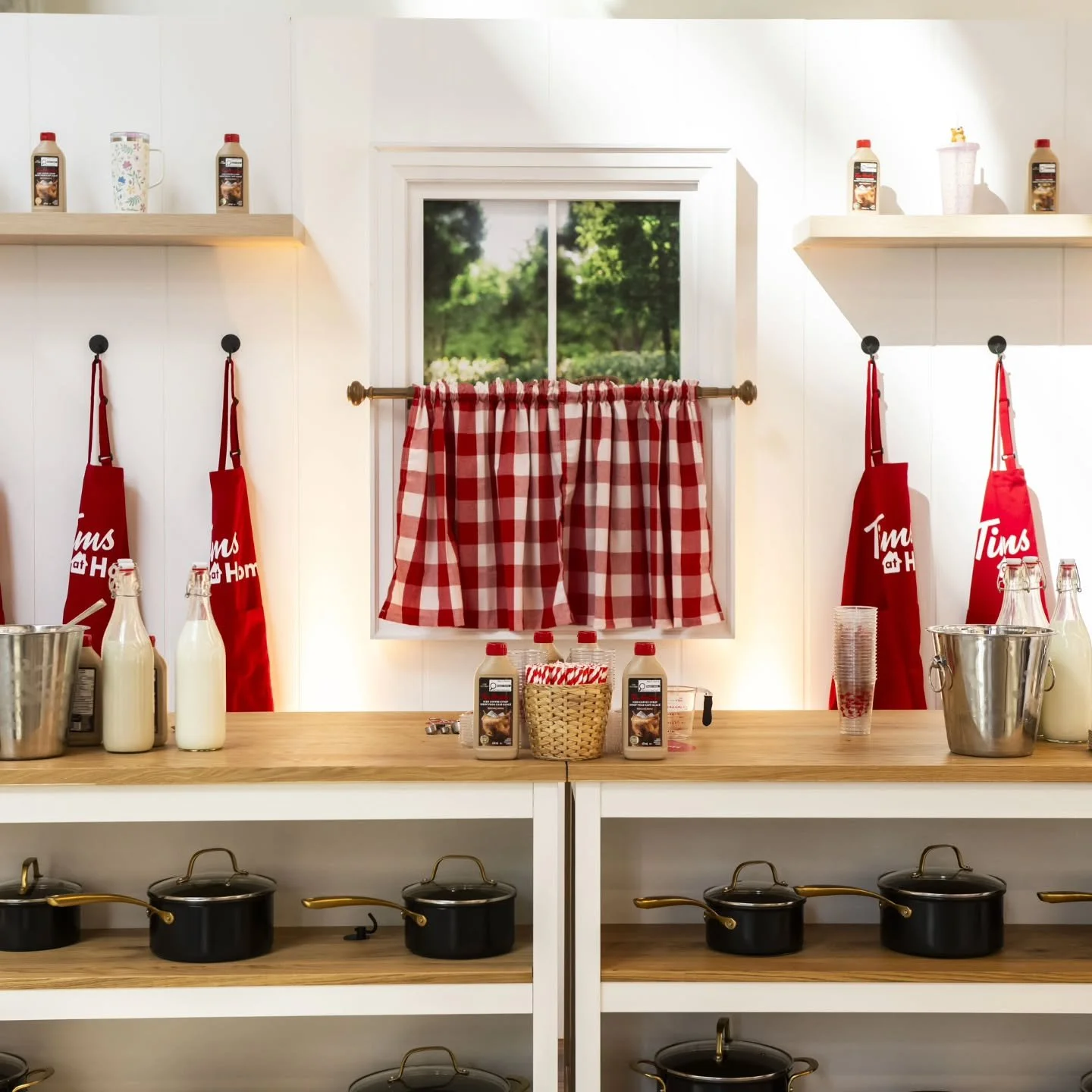 Our custom-built Tim Hortons-inspired kitchenette let guests apron up and create their own Tims Iced Coffee at home using the new Tim Hortons Iced Coffee Syrup. Featuring islands, shiplap walls, spring-inspired prints, and branded aprons, the setting