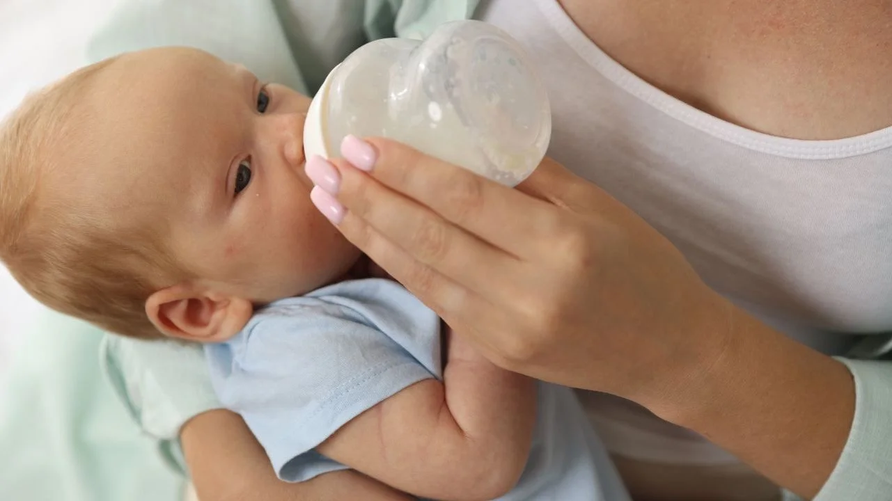 baby being fed a bottle