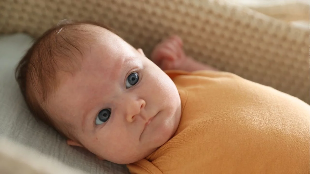 baby awake in bassinet