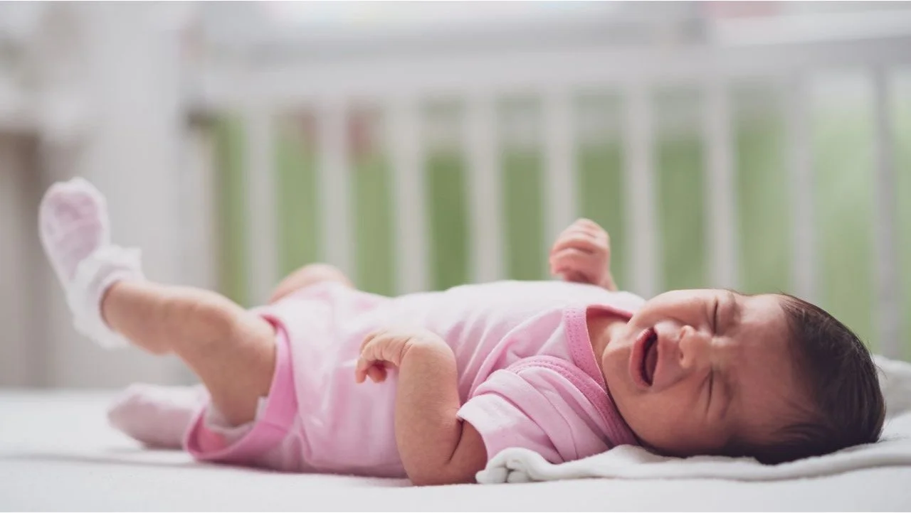 baby crying in crib