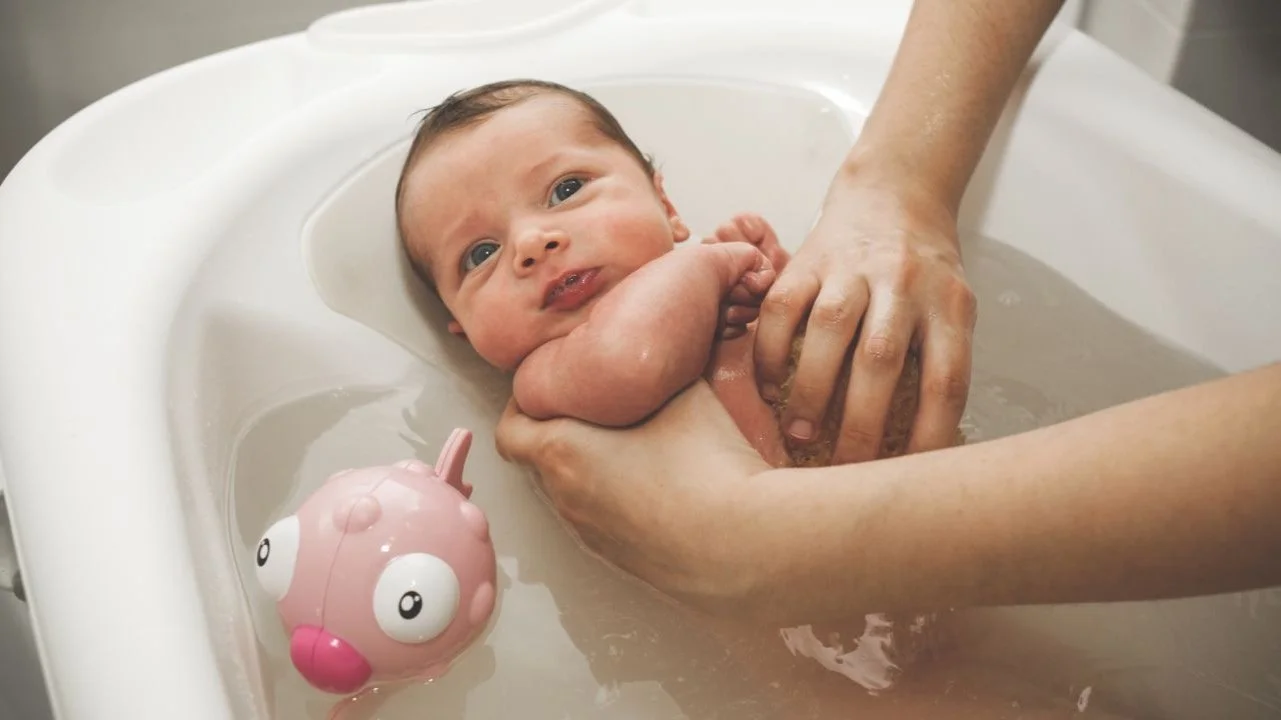newborn in a bath tub