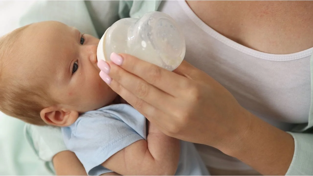 baby being fed a bottle