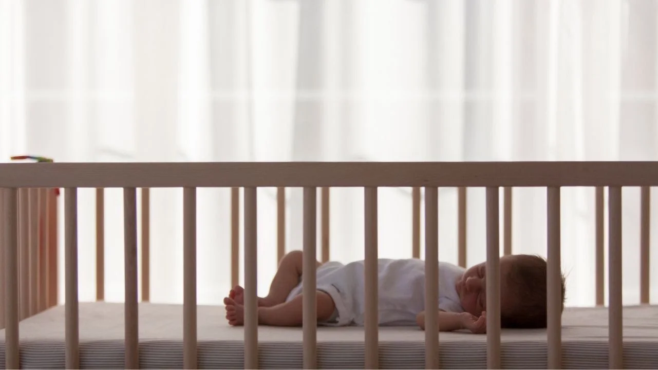 baby sleeping in crib