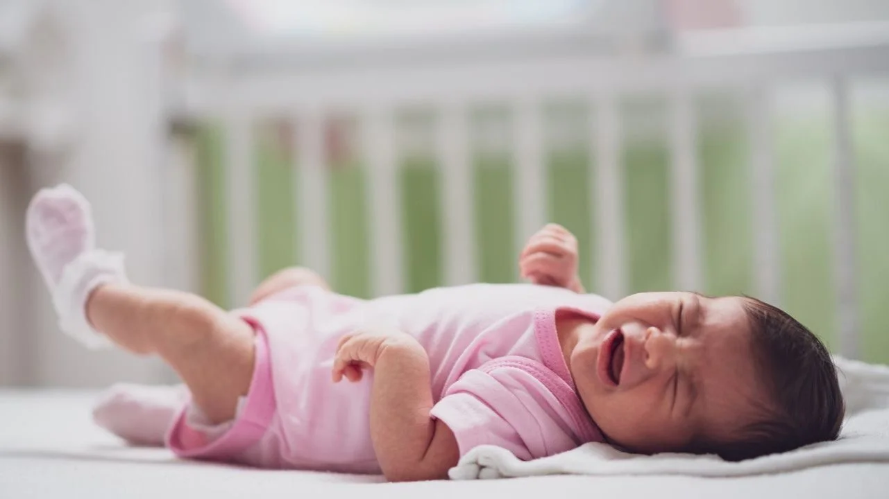 baby crying in crib