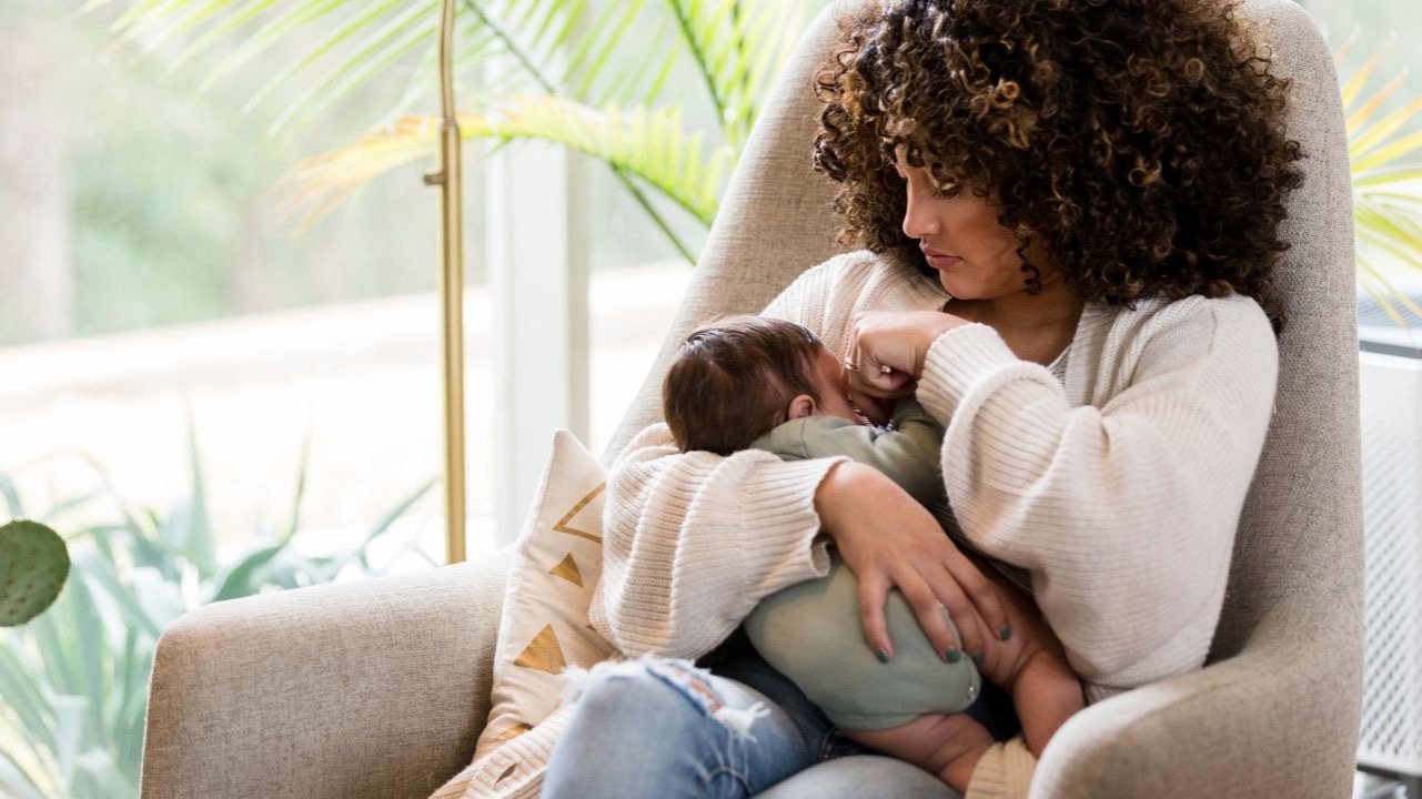 mother feeding her newborn