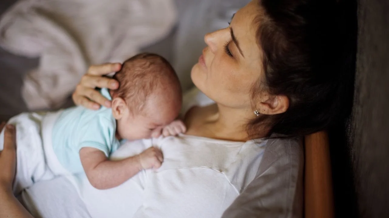 mom holding newborn baby