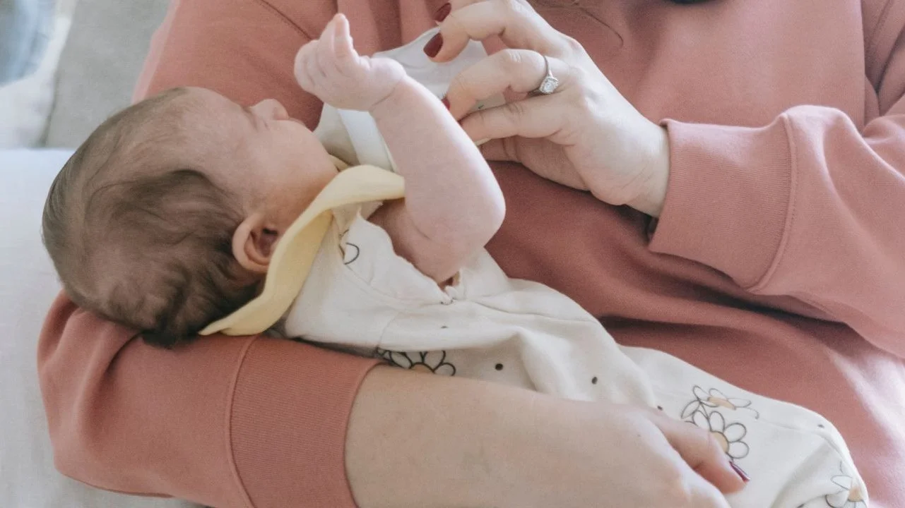 baby being fed a bottle