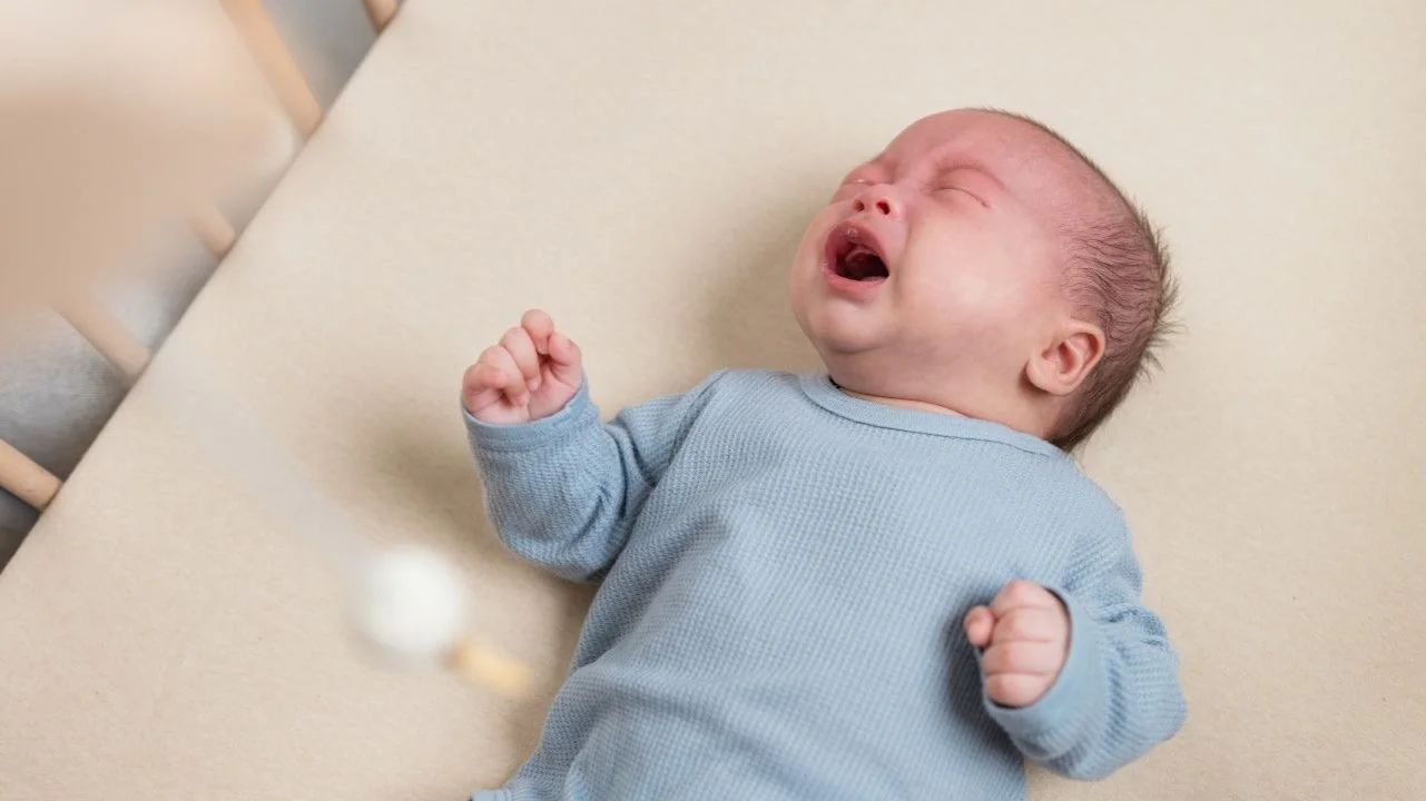 baby crying in crib