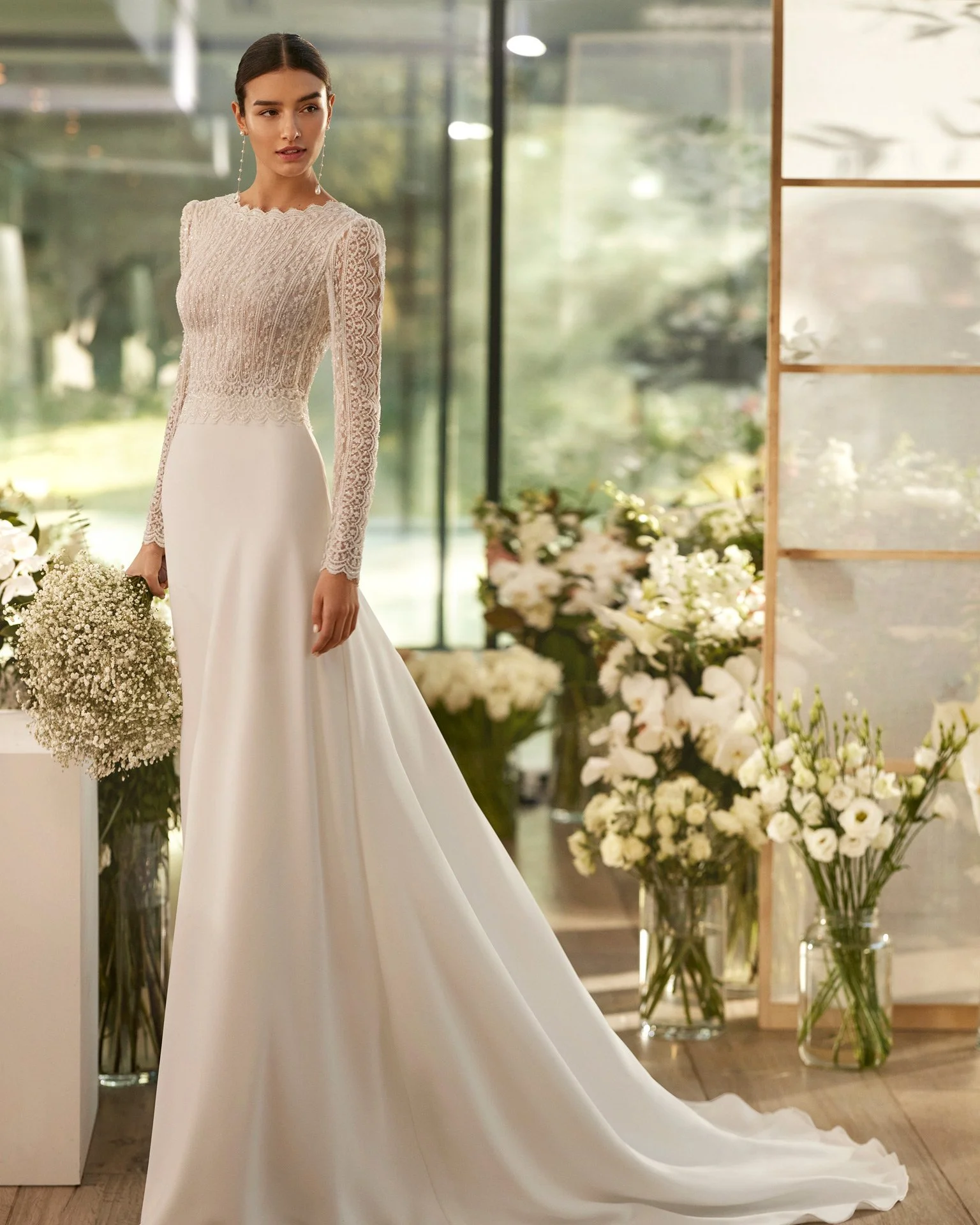 Bride in room of flowers wearing A-Line crepe and beaded wedding dress St. Clare Shores  Michigan