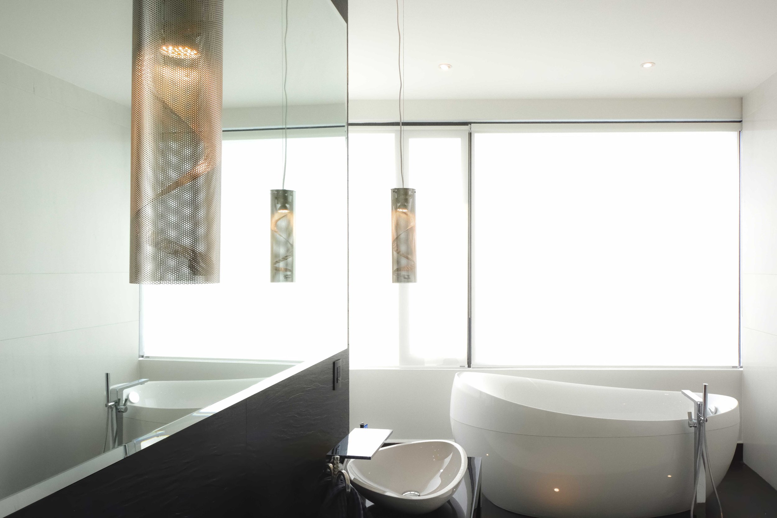 Custom furniture design by Ginard Studio | We designed and build the furniture of the master bathroom and included iconic bath products from the AXOR collection designed by Jean-Marie Massaud to give this bath a luxurious style.