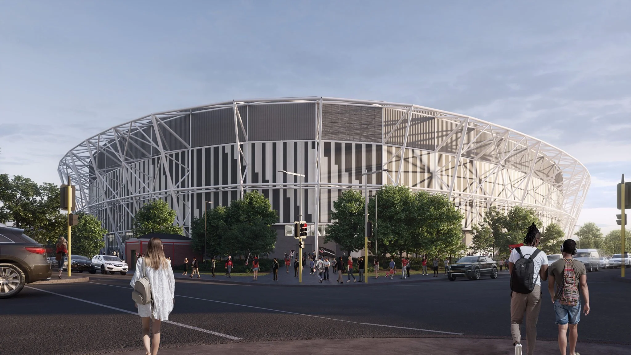 People walking on a street near a modern stadium with a distinctive white lattice exterior, trees, and parked cars.