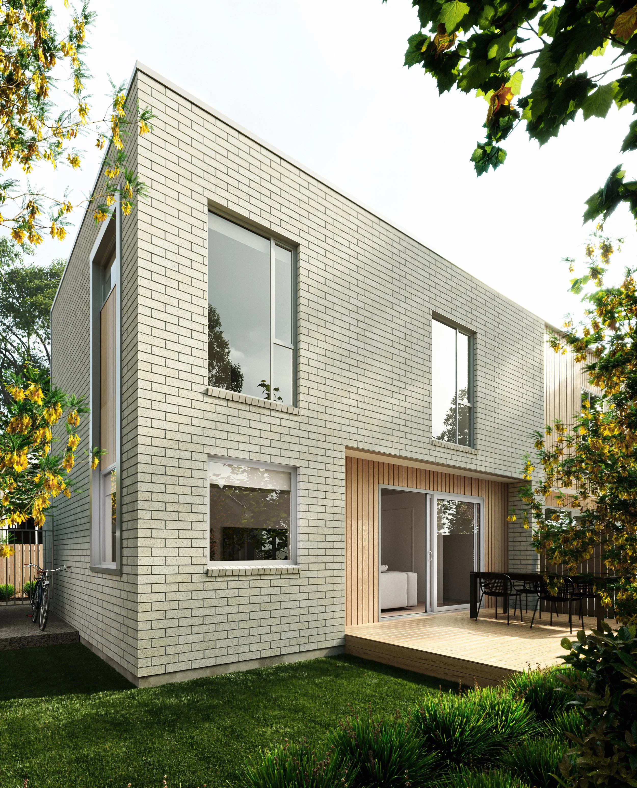 Modern two-story house with white brick exterior, large windows, and a wooden patio with outdoor furniture, surrounded by greenery and trees.