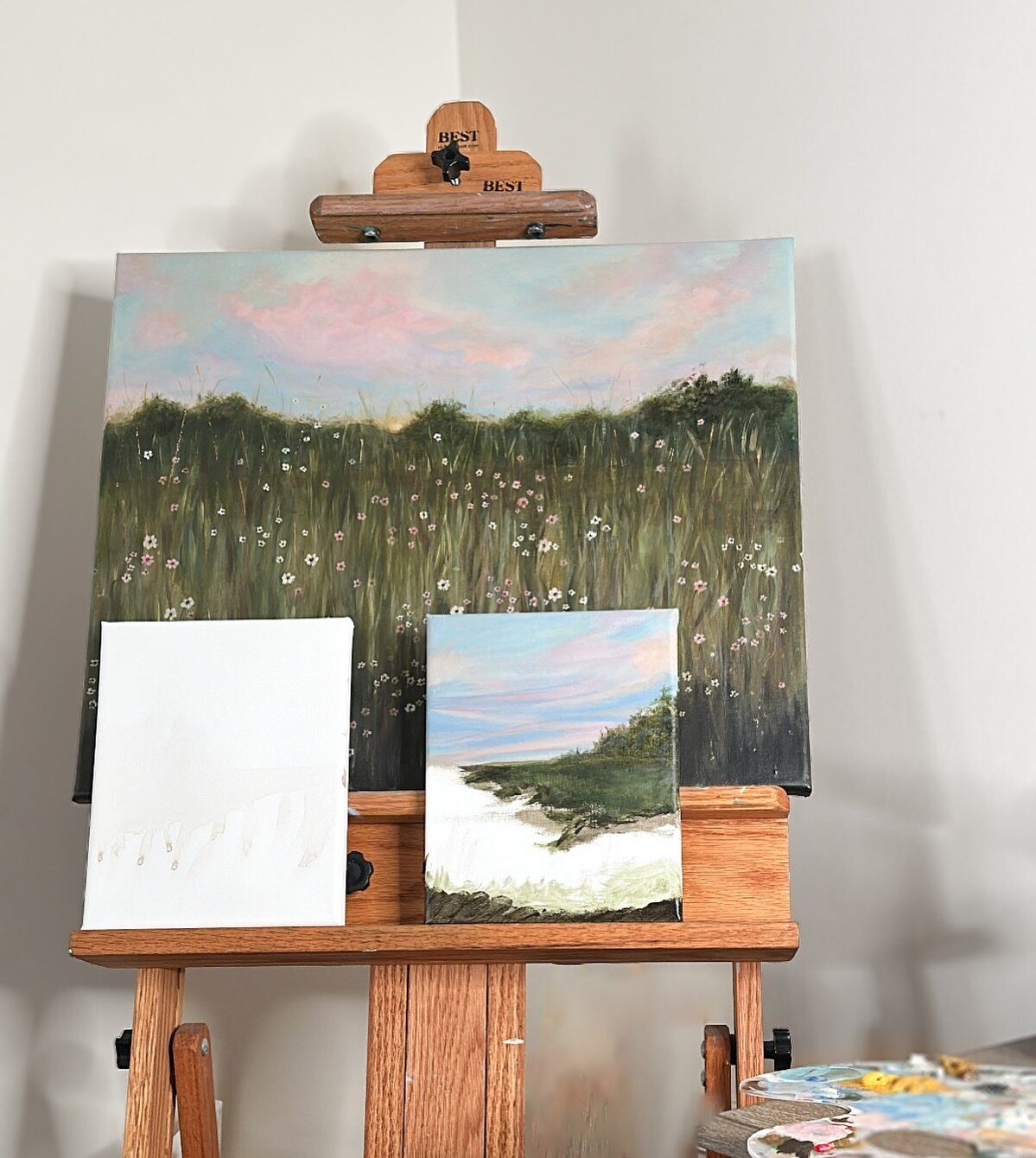 On the easel: A new collection of green grass and skies that sing of sunshine 🎶🌞🌳 This collection will be another small one with four total paintings. 

I will be sharing bits and pieces of its evolution in stories but I may be a bit quieter on he